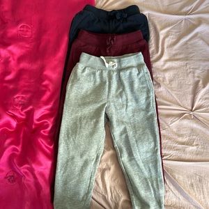 Bundle of 3 pairs of sweatpants. Burgundy, gray, and navy blue. 5/6